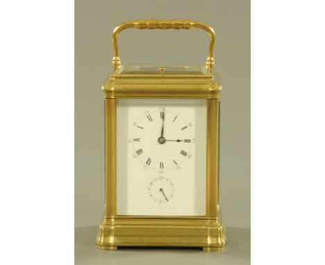 An Edwardian brass Grand Sonnerie carriage clock, with alarm and striking on two gongs and with repeat mechanism.  Height 14 
