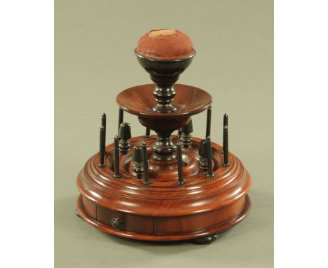 A Victorian mahogany bobbin and thimble stand.  Diameter 21 cm. CONDITION REPORT: The stand is in really very good condition.