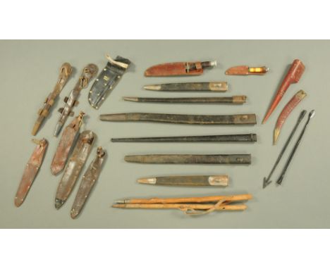 Five First World War bayonet scabbards, and a selection of other leather scabbards together with a few daggers and other item