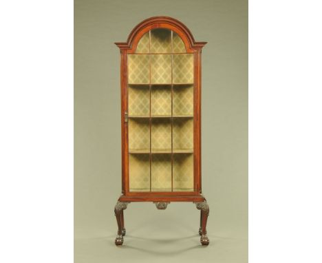 A Queen Anne style mahogany display cabinet, with arched pediment above a glazed door with wooden astragals enclosing shelves