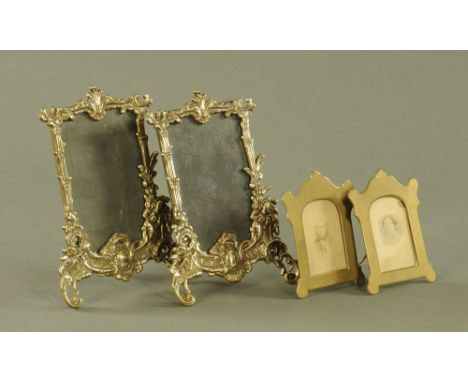 A pair of moulded brass photograph frames, together with a smaller Victorian pair of easel back photograph frames.  Tallest 2