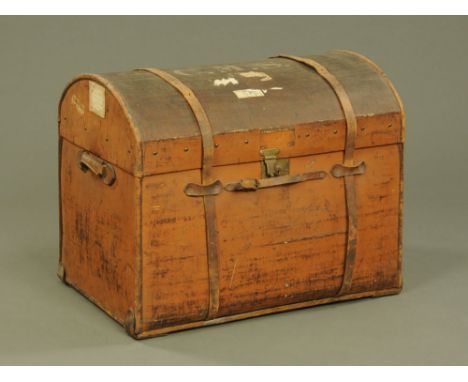 A large 19th century brown canvas covered domed top trunk, the lid initialled C.M.S. with leather carrying handles and outer 