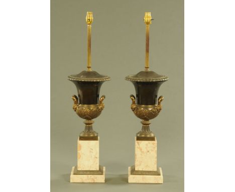 A pair of metal and marble table lamps, each in the form of a Campana shaped urn raised on a plinth.  Height to top of urn 49