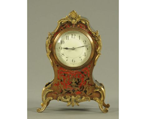 A 19th century Boulle style mantle clock, the enamelled dial with Arabic numerals and eight day movement.  Height 24.8 cm. CO