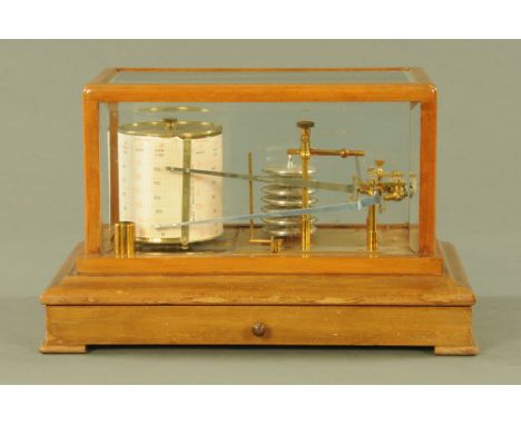 An early 20th century light mahogany and bevelled glazed cased barograph, retailed by Harrods, fitted single drawer, 38 cm x 