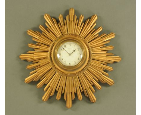 A giltwood framed Sunburst eight day wall clock, with French movement.  Width 35 cm. CONDITION REPORT: The movement is fully 