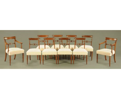 A set of two carver arm and eight single late Georgian mahogany dining chairs, each with bowed top rail and moulded stiles an