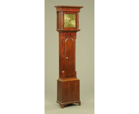 An early 19th century oak and mahogany banded longcase clock, with moulded cornice above the glazed door enclosing the unmark