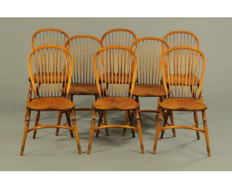 A set of eight Stewart Linford ash Windsor style dining chairs, each with crinoline stretcher.  Height to top of back 97 cm, 