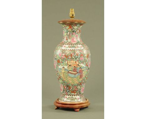A large Chinese Famille Rose Cantonese table lamp, with wooden stand and base.  Height including light fitting 59 cm.