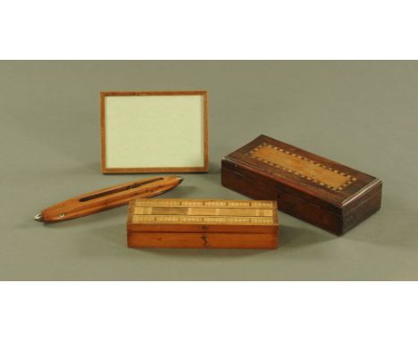 A Victorian walnut cribbage box, containing dice, pegs and playing cards.  Length 27 cm, together with a shuttle picture fram