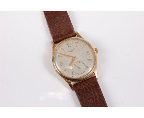 A gentleman's mid 20th century Longines manual wristwatch, the round dial with gold tapered baton and Arabic numerals, second