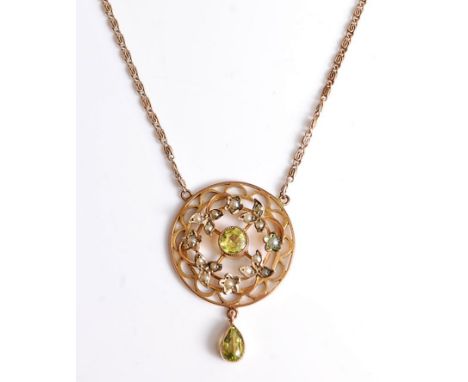 A peridot and seed pearl pendant and chain, the round frame set with a central round peridot in collet mount and surrounded b