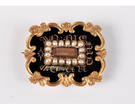A 19th century memorial brooch, the central rectangular glazed panel with fine blonde hairwork behind, surrounded by seed pea