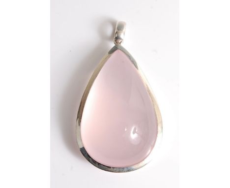 A large rose quartz and silver pendant, the pear shaped cabochon, approx. 57mm long, in a 4mm wide collet mount, with hanging