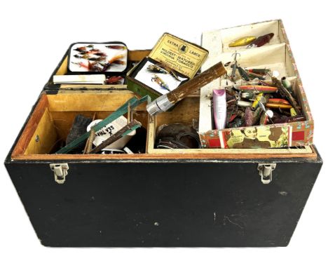 A tackle box with a large quantity of fishing equipment, including flies.  The Alastair & Sheila Brooks Collection: of Oaklan