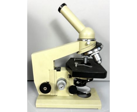 A NOMO Biolam microscope, 29 cm, with original box and glass slides.&nbsp;