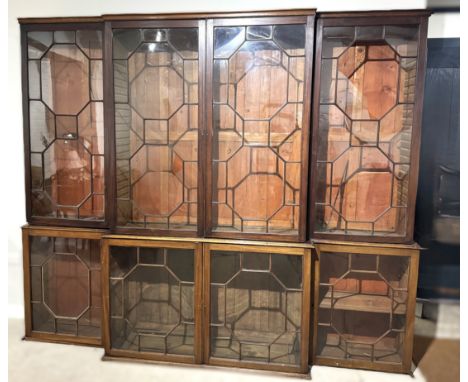 A George III style breakfront mahogany bookcase, 19th century and later, fitted with adjustable shelves, 222cm high, 268cm wi