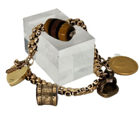 A 15ct gold charm bracelet with 15ct gold padlock, a 1900 gold sovereign and three unmarked charms, 37.4 g gross.&nbsp;