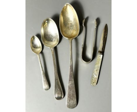 A Victorian hallmarked silver spoon, also another hallmarked spoon and sugar nips, 104g gross, along with a continental servi