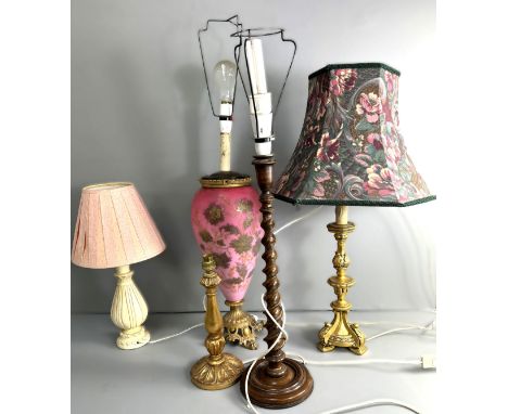 A group of lamps, to include; a c. 1900 coloured glass lamp, a spiral twist wooden lamp, 53 cm, (5).  The Alastair & Sheila B