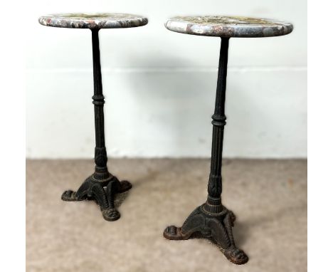 A pair of stone topped garden jardini&egrave;re stands or occasional tables on cast iron tripod bases, 60 x 30 cm.