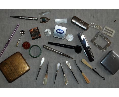 Interesting mix of personal nick-nacks, including button hooks, compact etc