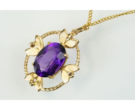 9ct gold and amethyst pendant necklace being set with an oval cut amethyst in a open work setting on a 9ct trace chain. Penda