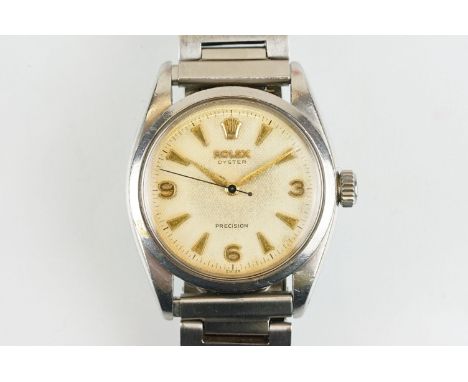 Rolex Oyster Precision stainless steel wrist watch having a round textured dial with triangular baton markers to the chapter 