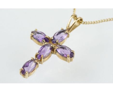 9ct gold and amethyst cross pendant necklace having a fine link chain with spring ring clasp, the pendant set with five oval 