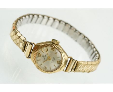 9ctr gold cased verity cocktail watch having a silvered face and expandable bracelet strap. Case marked 375. Face measures 18