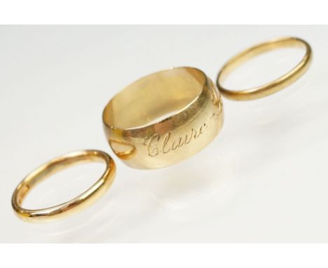 Three 9ct gold hallmarked wedding band rings. The lot to include a wide band ring engraved Claire Louise (hallmarked Birmingh