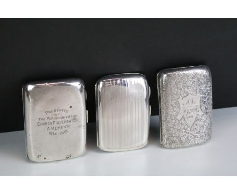 Three silver cigarette cases to include a late Victorian example with engraved scrolling decoration, approx 8.5cm long (Birmi