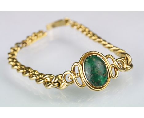 Green turquoise and gold bracelet having an oval turquoise cabochon set to the centre within a crossover mount, set with a ma