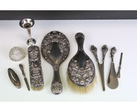 Collection of early 20th Century vanity items most having repousse detailed backs to include a Walker and Hall brush and mirr