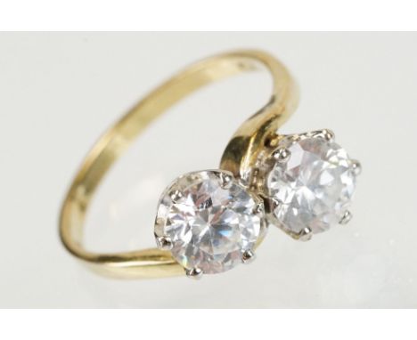 9ct gold and white stone toi et moi ring set with two round brilliant cut white stones. Hallmarked Sheffield. Size L.5.