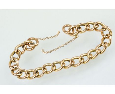 9ct rose gold curb link bracelet having textured detail to each link. Links marked 9ct. Measures 7 inches. No clasp present. 