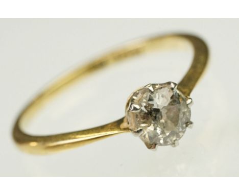Diamond solitaire ring being set with a round cut diamond to a plain shank with pink shoulders. Shank marked 18 &amp; plat. D