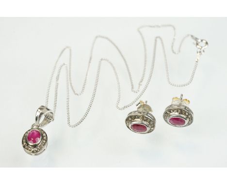 Ruby and diamond pendant having an oval cut ruby to centre with a halo of diamonds to the mount. Bale and chain marked 925 fo