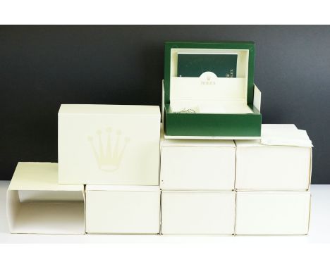 A collection of five green empty Rolex watch cases complete with swing tags and outer cardboard boxes together with an empty 