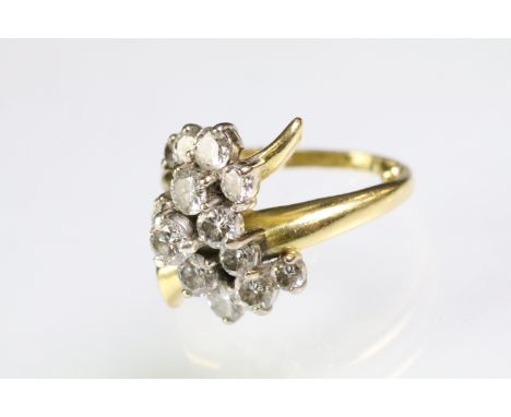 Mid Century Vintage yellow gold and diamond crossover cluster ring being set with fifteen round brilliant cut diamonds within