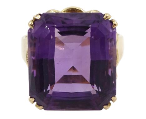 Large gold single stone amethyst ring, with knot design gallery, stamped 9ct