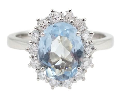 18ct white gold oval aquamarine and diamond cluster ring, hallmarked, aquamarine approx 0.95 carat