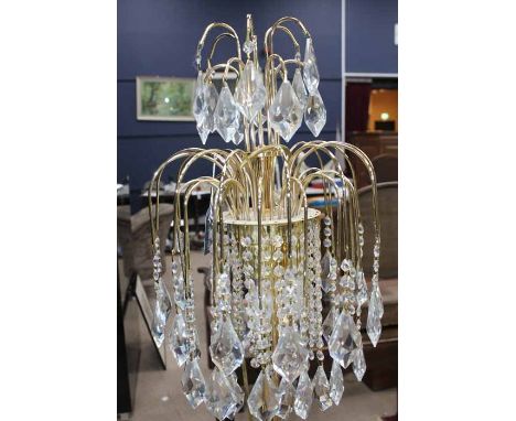 MODERN BRASS AND CUT CRYSTALSTANDARD LAMP
each branch with crystal pendants, 164cm high