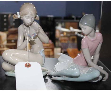 TWO LLADRO FIGURES
one of a ballerina,17cm high, the other of a girl with a butterfly, 19cm high