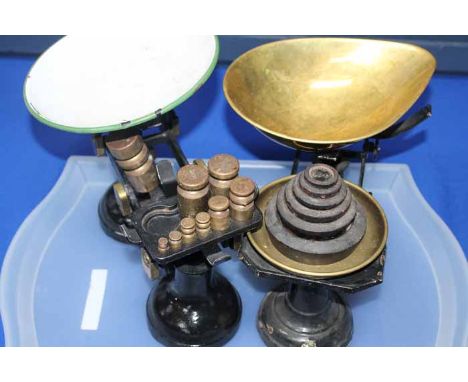 TWO VINTAGE KITCHEN SCALES
one with a brass bowl and brass weights, the other with a enamel pan and cast iron weights