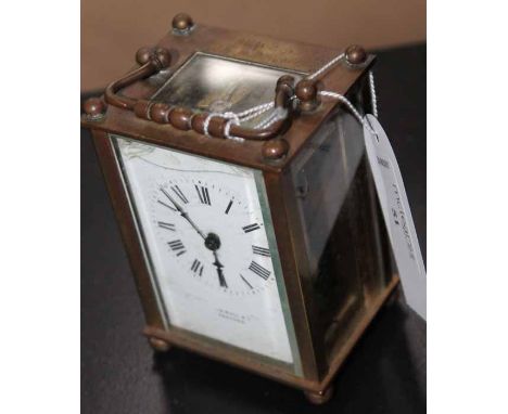 20TH CENTURY BRASS CASED CARRIAGE CLOCK
by R&Co., platform escapement, the white dial with Roman numerals, retailed by John B