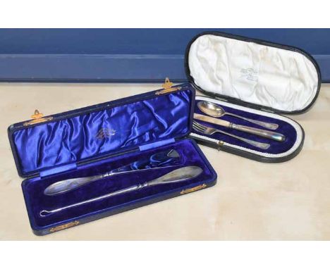 SILVER SHOE HORN AND BUTTON HOOK
together with a cased set of knife, fork and spoon set, both cased, larger case 27cm
