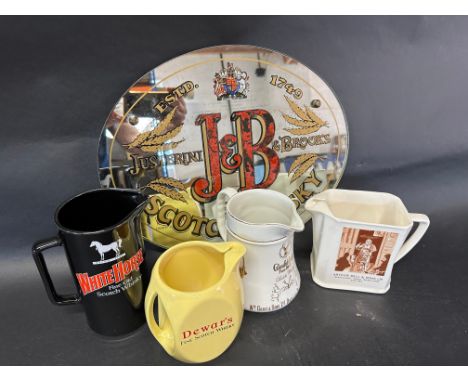 A J&amp;B Scotch Whisky pub advertising mirror and four whisky advertising jugs. 