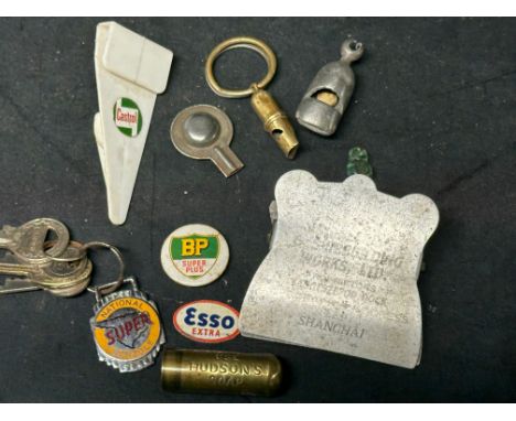A selection of advertising and collectables inc. three whistles, a National Benzole Super keyring, a BP Super Plus badge and 